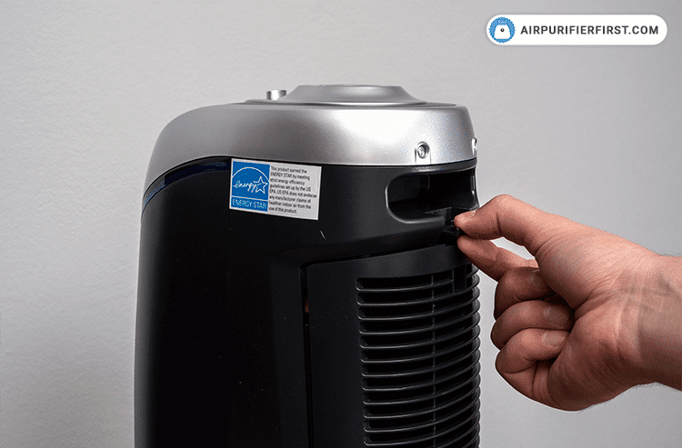 GermGuardian AC4825 - process of replacing filter - Opening the rear cover by pressing the lock and releasing the button.