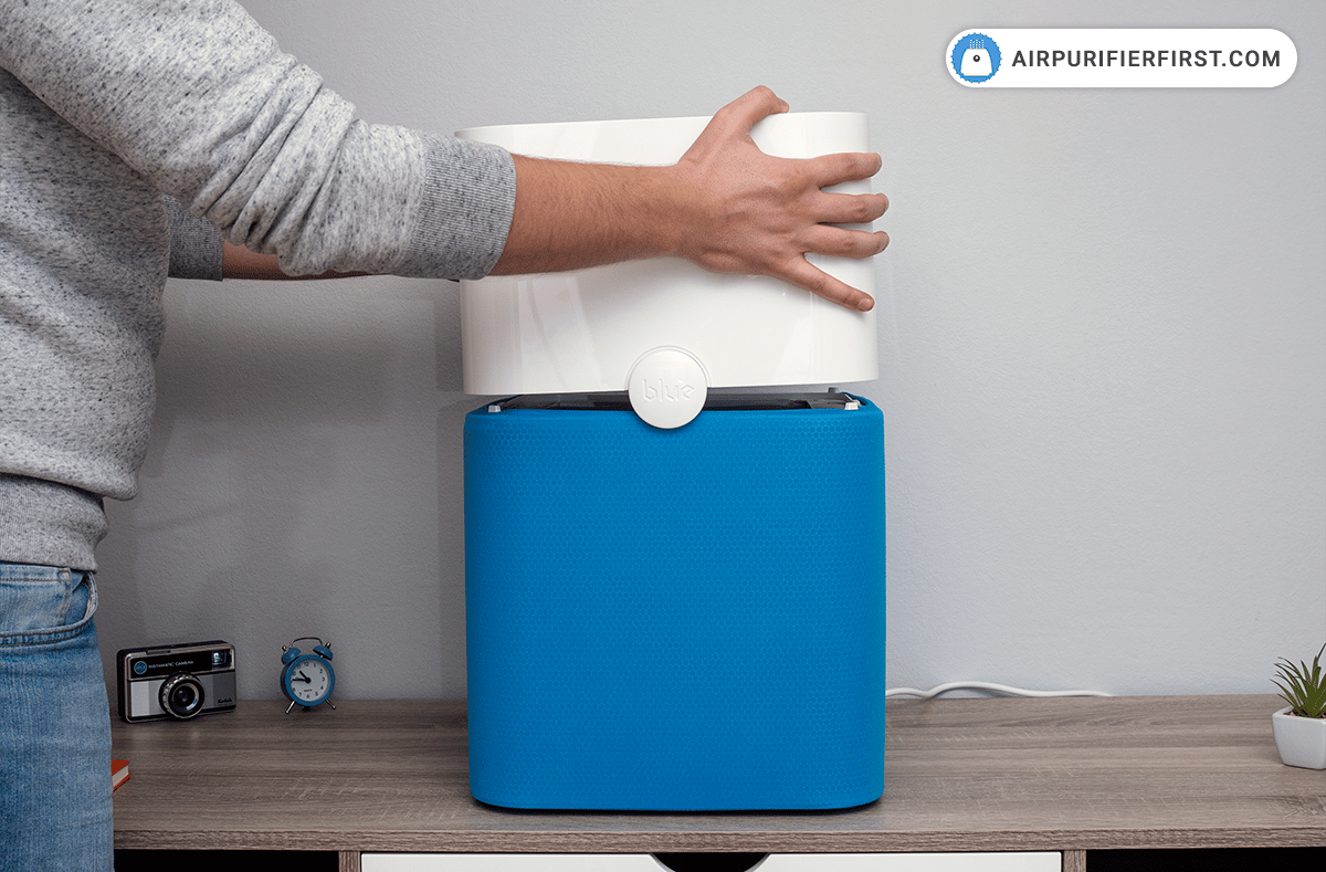 Put back the top part of the air purifier and press it slowly until you hear a click.