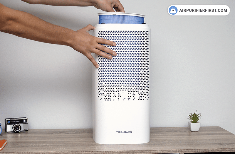 Unplugging FIWOTTTDA air purifier and unscrewing cover