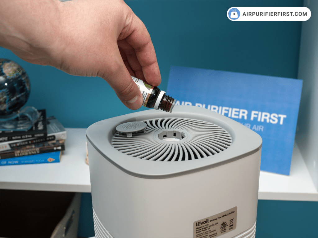 Pouring essential oil into the air purifier